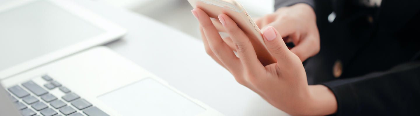 closeup businesswoman hands using smart phone and touch screen Woman using mobile device